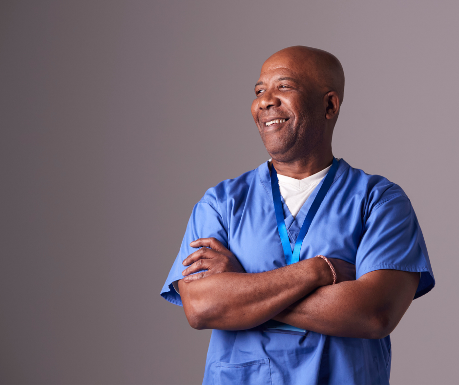 Male nurse smiling with arms crossed